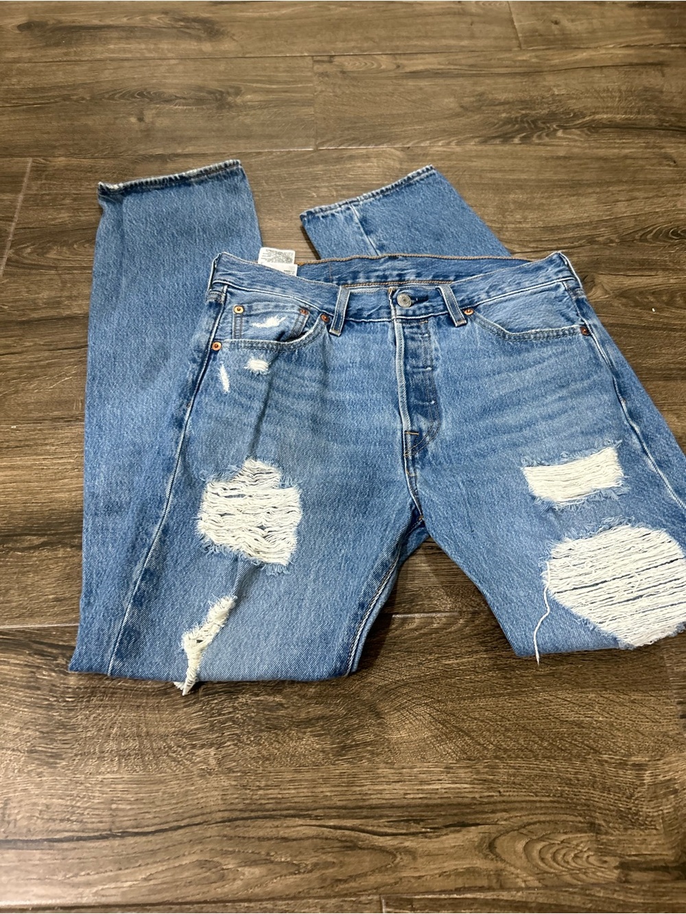 Levi's 501 light blue distressed jeans with contrast stitching